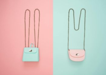 Stylish pastel handbags on pink and mint split backgrounds, perfect for fashion and design themes.