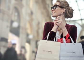 Stylish woman with shopping bags in Galleria Vittorio Emanuele II, Milan.